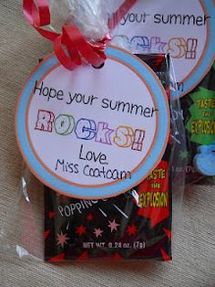 some candy bags are wrapped in clear cellophane and have tags on them that say, hope your summer rocks love miss cotton