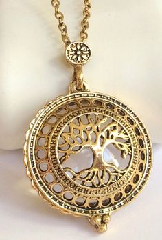 Gold Magnifying Tree of Life Necklace The tree of Life is a holy symbol in many religions. This is a beautiful representation of the Tree of Life. Vintage elements with a flair of a bygone era. Yellow gold plated metal alloy. Glass magnifying locket with a magnetic clasp. X-Long 24 inches. Great for sweaters or plus size gals. New with retail packaging. Visit My eBay Store: PrettyPrettyPlusSizeStore Holy Symbol, Gold Tree Of Life, Vintage Style Necklace, Vintage Plus Size, Angel Jewelry, Gold Tree, Vintage Style Rings, Tree Of Life Necklace, Celtic Jewelry