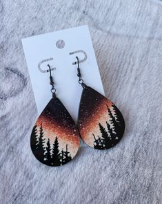 "Single Sided Sublimation Earrings *These Gorgeous sublimated earrings have the design on the front side, with the back being a dark brown. They are light weight and the colors are bright and vibrant! *Stainless steel fish hook hardware * 2\" Teardrop shape length. Total Length 2.5\" *Made from 1/8\" thick MDF hardwood with acrylic front. *Note that colors may appear slightly different on your computer/phone/tablet in comparison to actual design. *Ask about personalization and custom designs bea Diy Painted Earrings, Painted Wood Earrings Ideas, Wood Earring Designs, Wooden Painted Earrings, Wood Earring Ideas, Diy Wood Earrings, Wood Earrings Diy, Hand Painted Earrings Wood, Sublimated Earrings