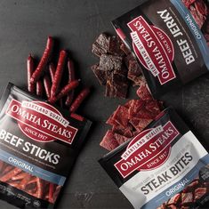 three bags of beef sticks next to each other on a black counter top with one bag of beef sticks in the middle