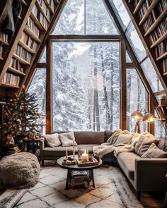 a living room filled with furniture and bookshelves in front of a large window