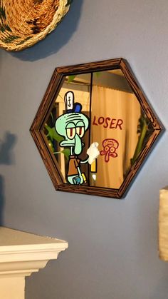 a mirror that is hanging on the wall