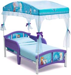 a child's bed with a canopy over it