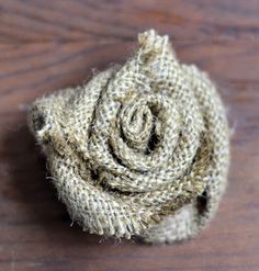 a piece of fabric sitting on top of a wooden table