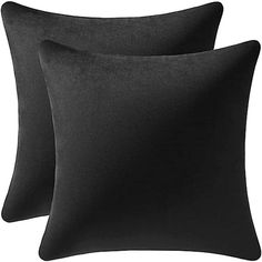 two black pillows sitting next to each other