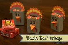 three boxes with turkeys made out of them and some candy bars in the middle