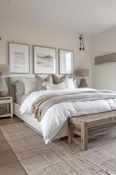 a large bed sitting in a bedroom on top of a wooden floor next to two lamps