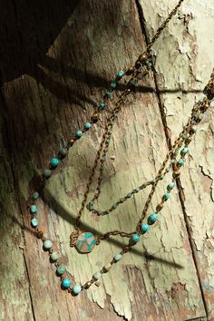 Whether worn as a statement accessory or a reminder of wanderlust, the Turquoise Cascade Necklace is sure to elevate any ensemble with its timeless beauty and charm, evoking a sense of adventure and exploration! Unique necklace that can be work 5 different ways: long necklace, choker necklace, bracelet, individual chain, or layered with all strands! Includes 3 layers Bronze chains, turquoise and bronze beads of various sizes, and statement turquoise pendant Magnetic closure that allows for conve Adjustable Multi-strand Bohemian Turquoise Necklace, Turquoise Multi-strand Bohemian Necklace, Boho Essentials, Cascade Necklace, Nickel-free Bohemian Turquoise Metal Necklace, Bralette Outfit, Bohemian Turquoise Multi-stone Pendant Necklace, Nickel-free Bohemian Dangle Turquoise Necklace, Unique Necklace