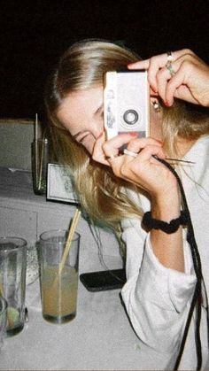 a woman taking a selfie with her cell phone