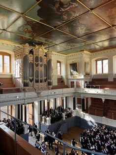 an overhead view of a large building with people standing in front of the pipe organ