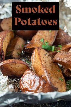 baked potatoes in foil with text overlay that reads smoked potatoes on the bottom right side