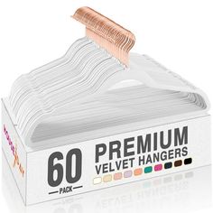 a pack of 60 premium velvet hangers in white packaging with gold foil on top