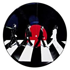 an image of the beatles on a black and white plate with red circle in background