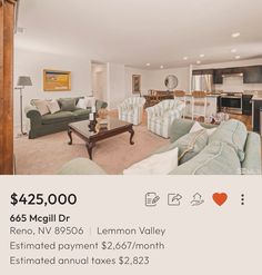 a living room filled with furniture next to a kitchen