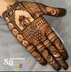 the hand is decorated with intricate designs