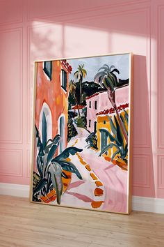 a painting hanging on the wall in an empty room with pink walls and wooden floors