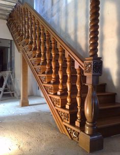 an old wooden staircase with handrails and balconies