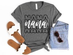 a t - shirt with the words nama nama on it next to some shoes and sunglasses