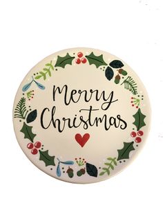 a merry christmas plate with holly and berries