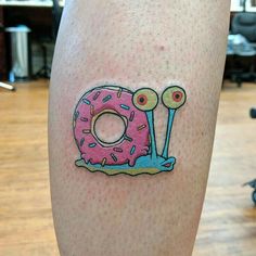 a donut with sprinkles is on the leg