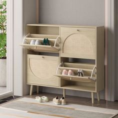 a wooden cabinet with two shelves and shoes on the floor