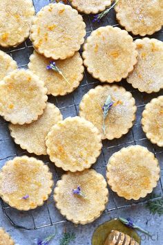 several small pies on a cooling rack with lavender sprigs in the background