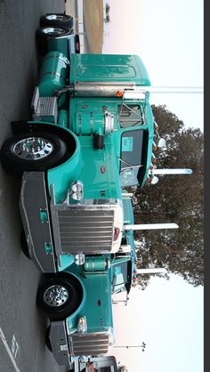 a large semi truck parked next to a building