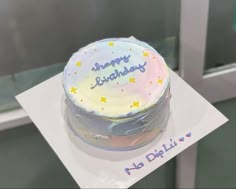 a happy birthday cake with stars on it