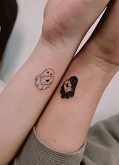 two people with matching tattoos on their wrist