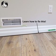 an air conditioner sitting on top of a wooden floor next to a wall with the words learn how to fix this