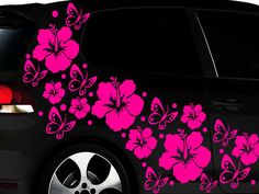 a car with pink flowers painted on it