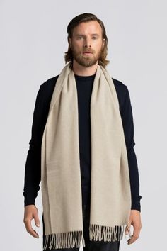 The ultimate fall-winter accessory remastered: Our classic scarf is now woven from 100% recycled wool, increasing the share of cashmere from 10% to 45% for even greater comfort. With the luxurious warmth of wool and incomparable softness of cashmere, you'll be begging summer to stay away. Luxury Shawl Collar Cashmere Sweater, Luxury Cashmere Shawl Collar Sweater, Luxury Merino Wool Sweater With Shawl Collar, Cashmere Hats For Men, Luxury Fall Cashmere Hat, Luxury Chic Beige Scarves, Luxury Gray Scarf For Winter, Luxury Gray Scarves For Winter, Luxury Brown Winter Scarves