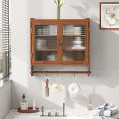 Description: Timeless Vintage Style: This kitchen wall cabinet embodies vintage home charm with its clean lines and minimalist design, enhancing your personal taste and complementing any interior decor with its rich brown color. Exceptional Material Choice: Featuring long iris glass with good craftsmanship, this wall cabinet is rust-proof and resistant to corrosion and wear. The fluted glass design allows for excellent light transmission, elevating your high-end home decor. Versatile Storage Solution: Designed with a 3-tier double door cabinet, this bathroom wall cabinet offers ample storage space, helping you stay organized for daily use, with each tier capable of supporting up to 5 kg/11 lbs. Adjustable Shelving: The removable shelves inside this bathroom cabinet wall mount allow for fle Fluted Glass, Bathroom Wall Cabinets, Material Selection, Glass Cabinet Doors, Cabinet Shelving, Pantry Cabinet, Wall Storage, Double Door, Door Wall