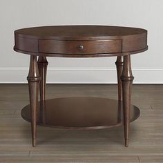 a wooden table sitting on top of a hard wood floor