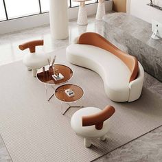 a modern living room with white and brown furniture