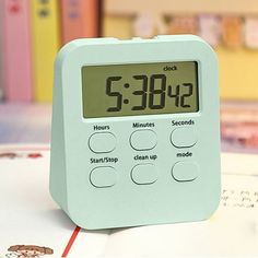 an alarm clock sitting on top of a table