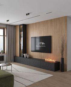 a living room with a large flat screen tv on top of a wooden wall next to a fire place