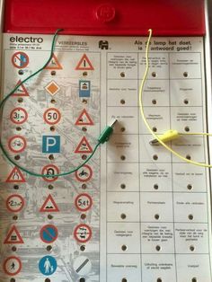 an electrical hazard sign is shown with wires and plugs attached to the back of it