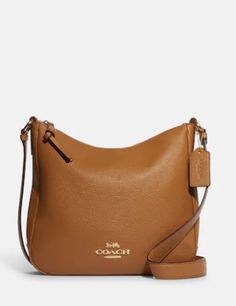 Refined pebble leatherInside multifunction pocketZip-top closure, fabric liningOutside zip pocketAdjustable strap with 21" drop for shoulder or crossbody wear10 1/4" (L) x 9 1/2" (H) x 2 3/4" (W)Style No. C1648Color: Light Saddle Neutral Handbag, Coach Outlet, Coach Crossbody, Classic Style Women, Bag Light, Gold Light, Coach Purses, Blue Bags, Pink Bag