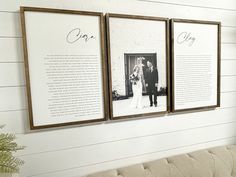 three framed photos hang on the wall next to a couch in a room with white walls