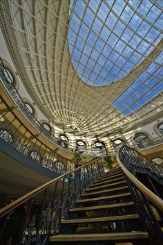 the inside of a building with stairs and skylights on it's ceiling is shown