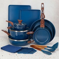 blue pots and pans with wooden utensils