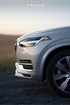 the front end of a silver volvo car with an advertise above it that reads learn more