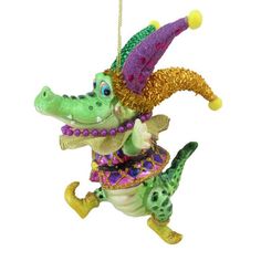 Jester cartoon alligator smiling and wearing a yellow, green, and purple Mardi Graw costume. Mardi Gras Theme, Jester Hat, Katherine's Collection, Good Times Roll, Unique Ornament, Gift Boutique, Hat Band, Gift Store, Glass Ornaments