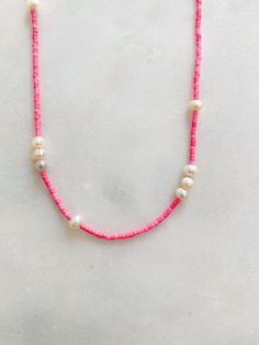 Pink Beaded Necklaces With Pearl Charm, Handmade Pink Pearl Beaded Necklaces, Pink Pearl Beaded Necklace With Pearl Charm, Adjustable Pink Pearl Necklace With Charm, Pink Pearl Necklace With Colorful Beads As A Gift, Dainty Pink Pearl Beaded Necklaces, Pink Pearl Chain Beaded Necklaces With Round Beads, Handmade Pink Necklaces For Everyday Wear, Pink Necklaces With Pearl Charm And Round Beads