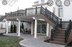 an outdoor patio with stairs leading up to the second floor