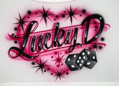 a t - shirt with the word lucky d on it and dices in front