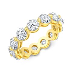 a yellow gold ring with five round diamonds on the side and two rows of white stones in