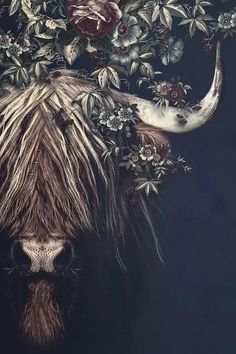 an animal with long horns and flowers on it's head is featured in the image