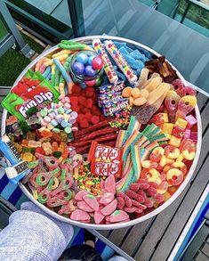 a large bowl filled with lots of candy and candies